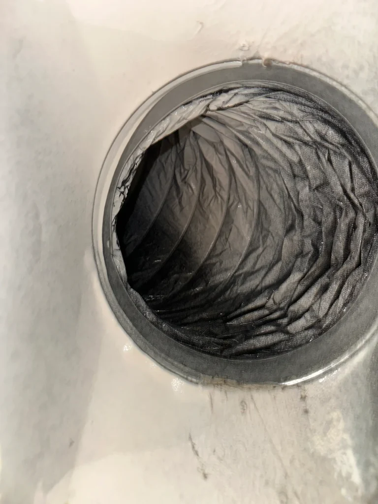 Flexible residential air duct after deep cleaning removed the heavy interior buildup
